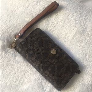 Michael Kors wallet and phone holder.